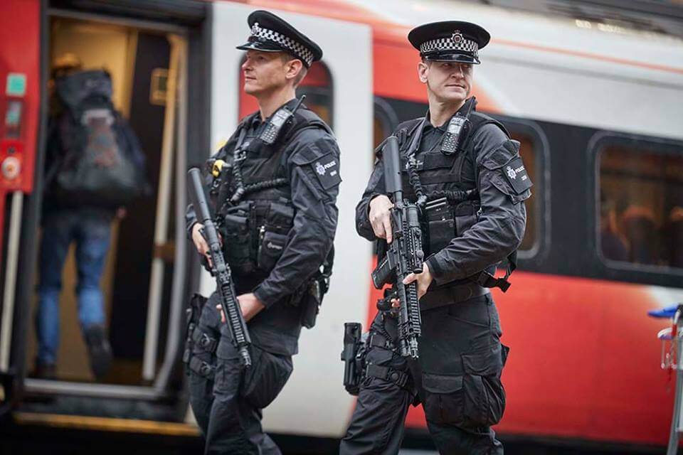 Armed Police Officers Patrol UK Train Services