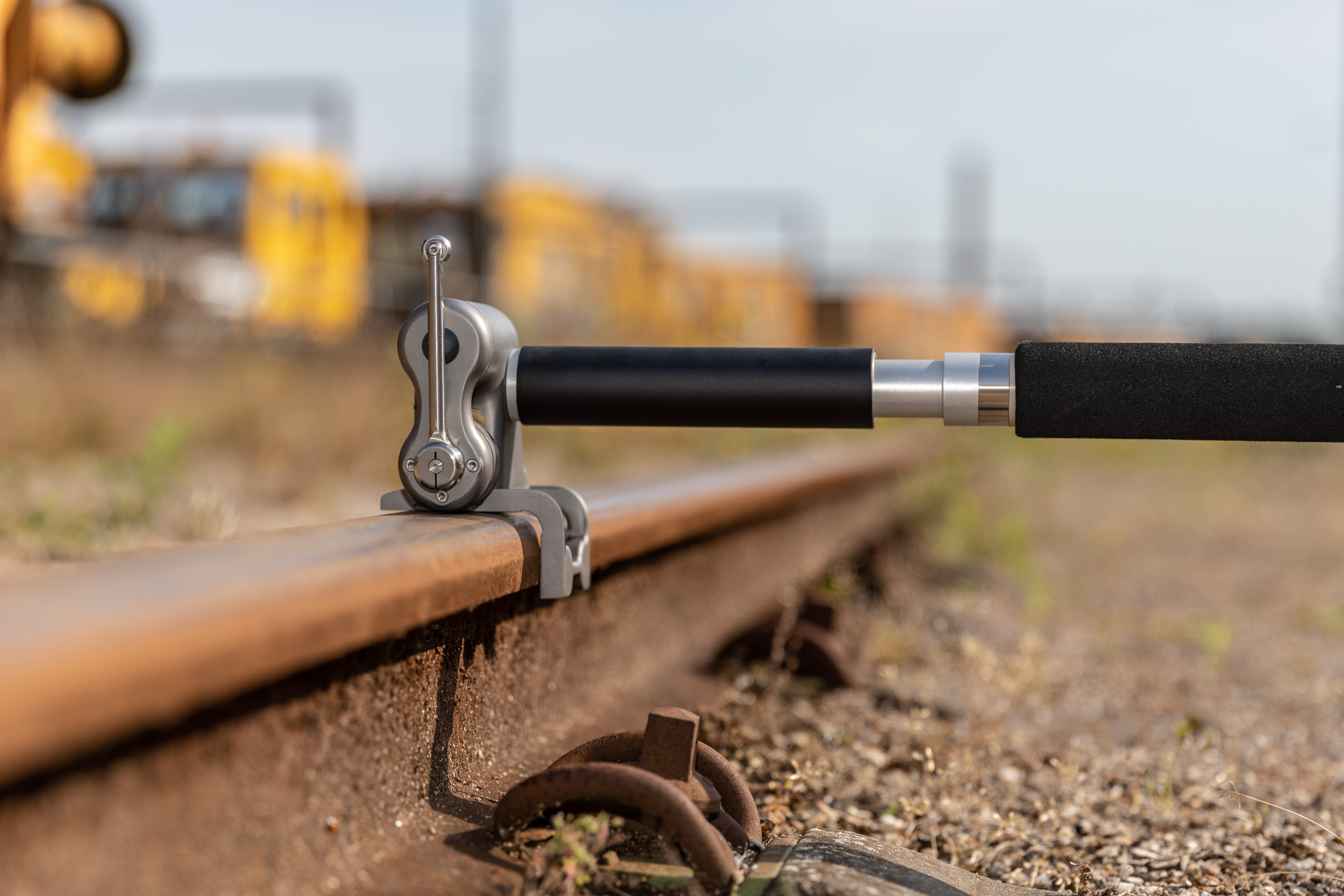 Close-up of the MiniProf BT Rail unit in use – the unit sits on the rail, ready for the measuring wheel to take the rail’s profile