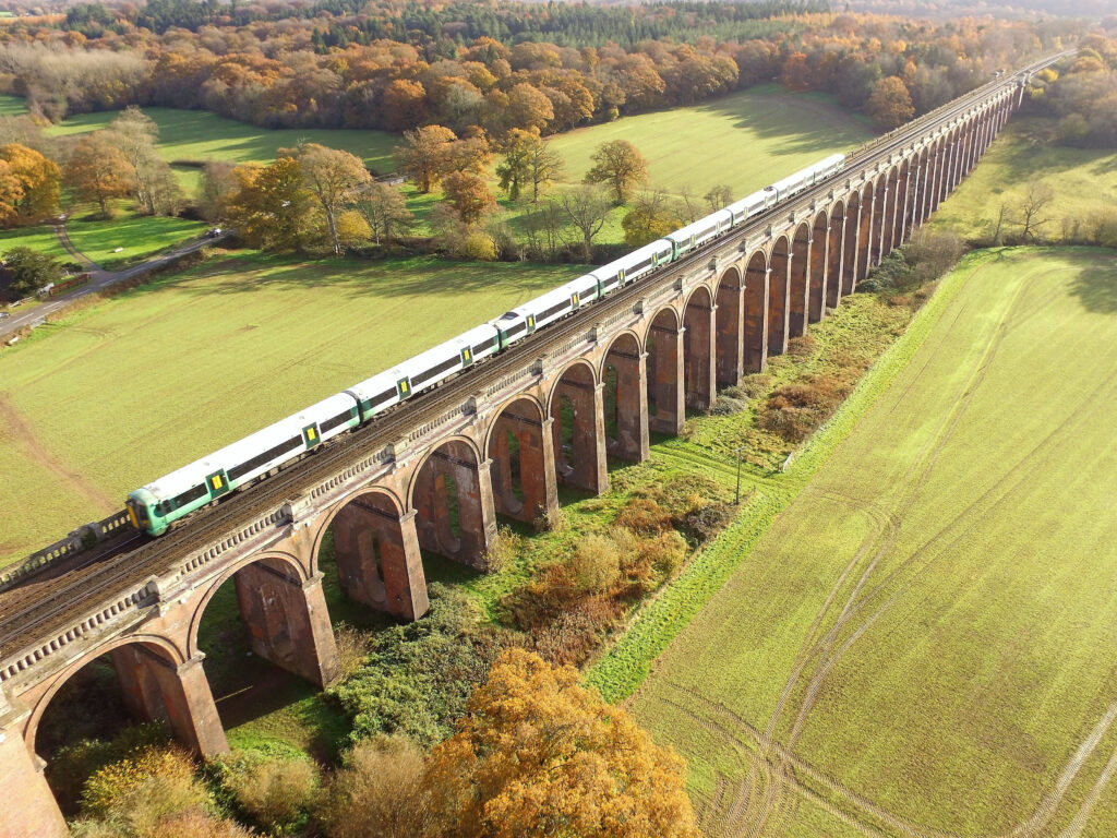 A Southern train passes over Ouse Valley Viaduct