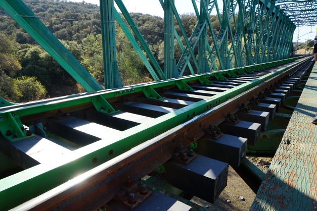 Metallic bridge over the Guarrizas river with plastic sleepers