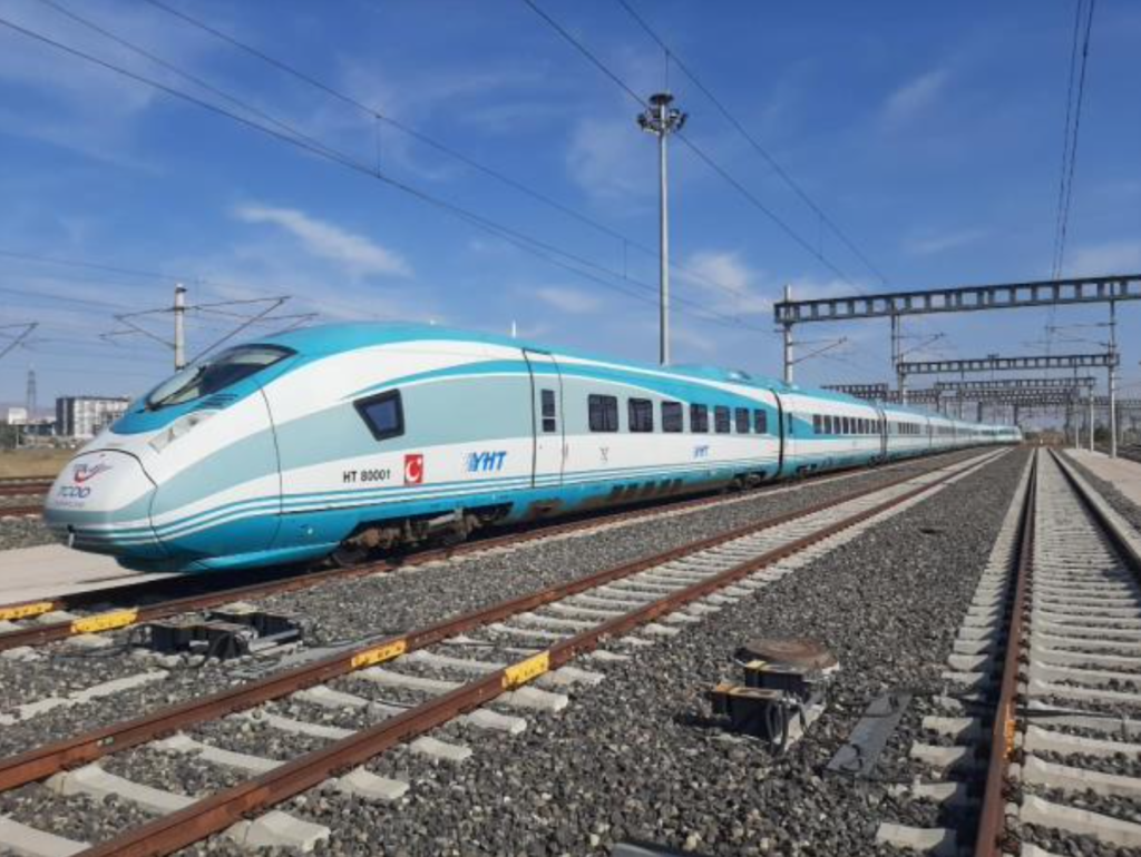 A blue high-speed train on the tracks