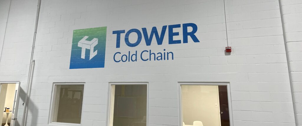 A painted sign on a wall reading Tower Cold Chain