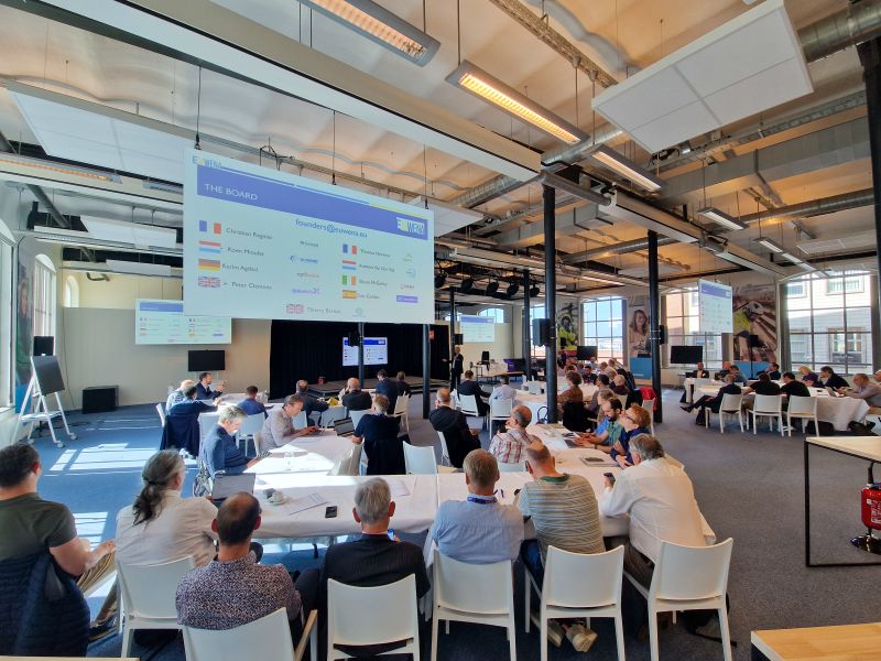 Participants listening as a speaker discusses the future of railway telecommunications