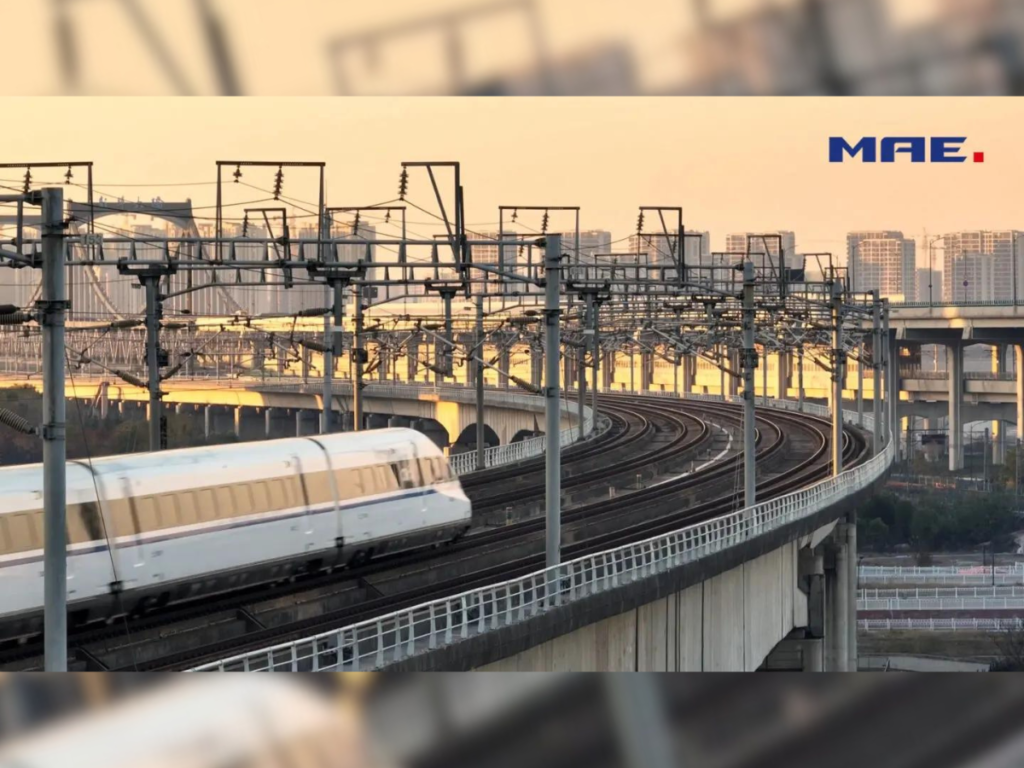 An image of a train riding into a railway station