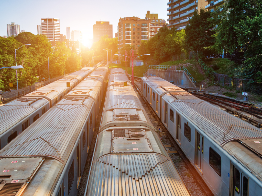 An image of a fleet of train carriages in the sunset