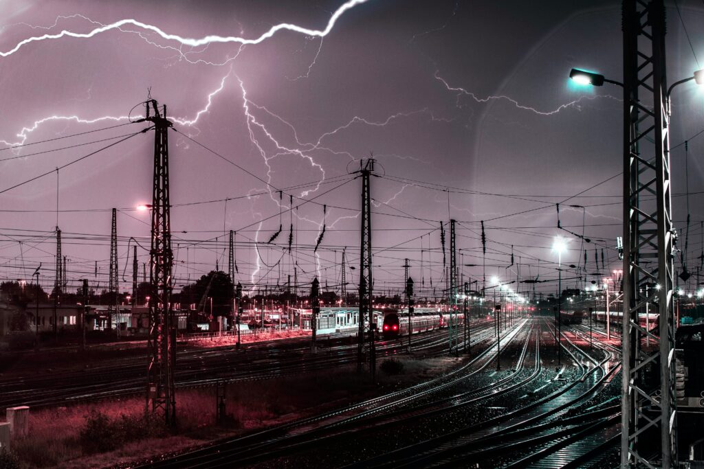 An image of a lightning storm above a railway station