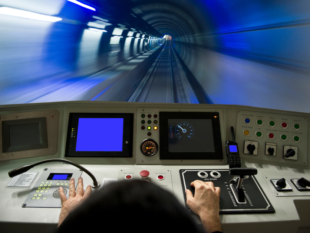 A first person perspective view of a train driver driving a train through a tunnel at a high speed