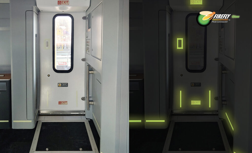 An interior train door in the light. Then the same door in the dark, showing luminescent emergency tape and signs