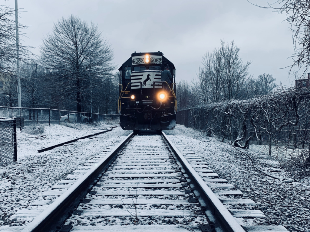 A train driving in the snow