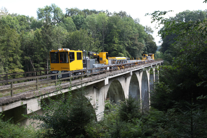 An image showing rolling stock crossing a viaduct