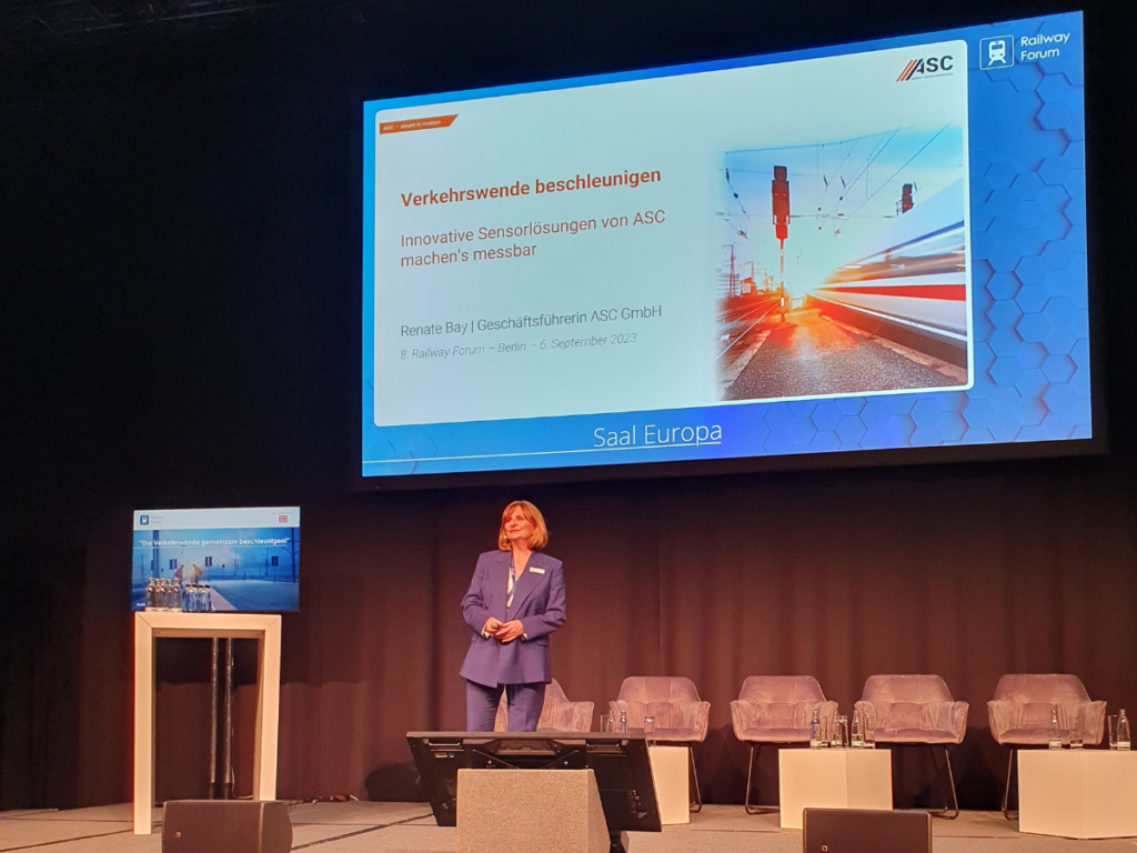 Renate Bay, CEO of ASC Sensors giving a presentation on stage at the Railway Forum