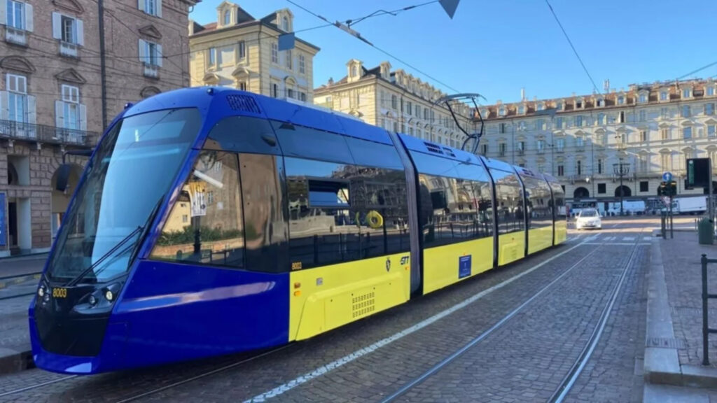 A dark blue and yellow tram train