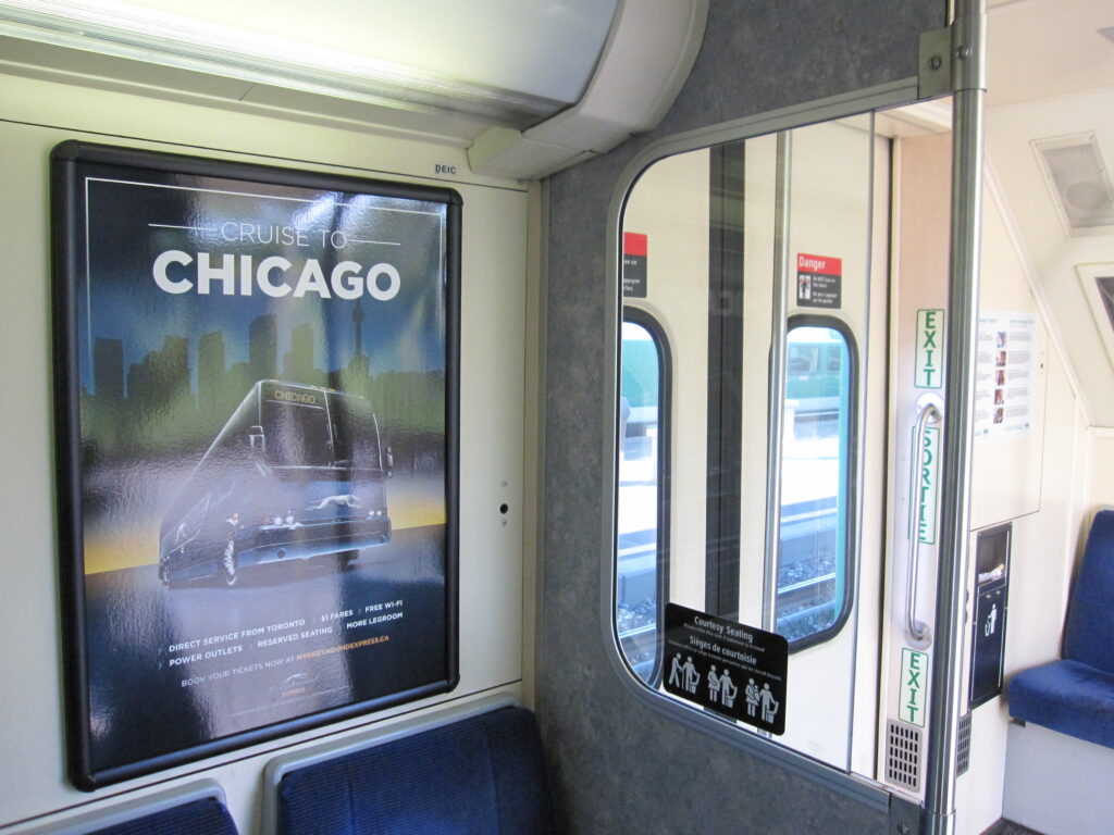 An advertising frame on a train interior wall