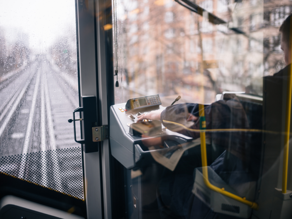 We see the tracks from behind the shoulder of the train driver in his cabin