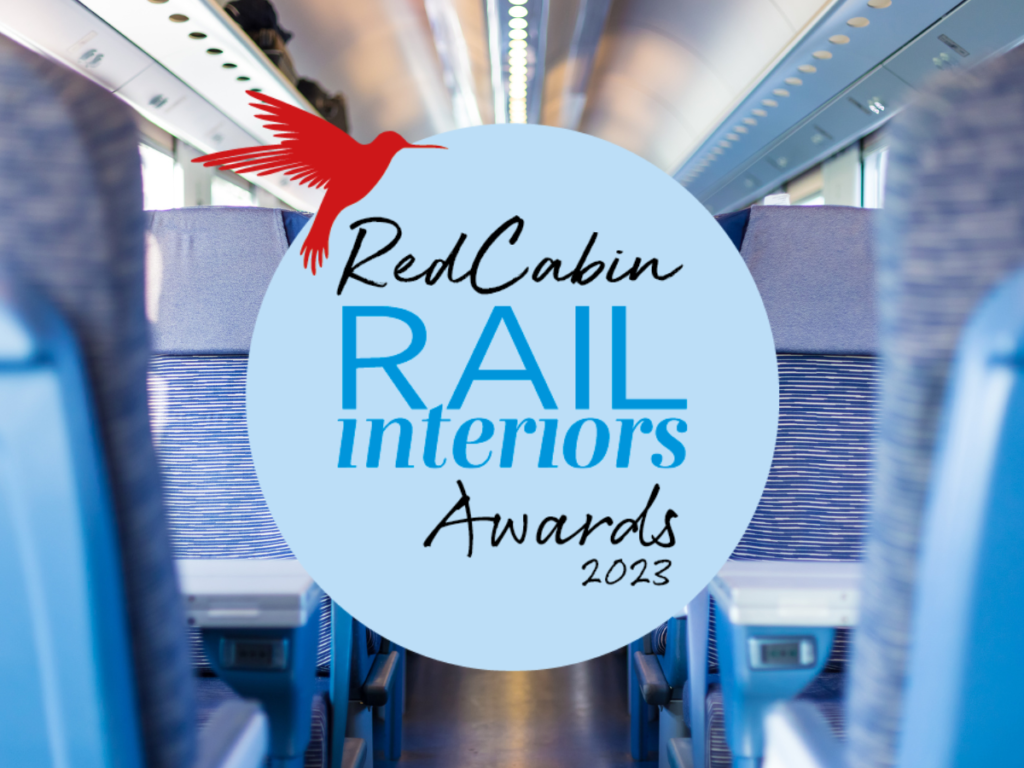 Seats inside a train with the "RedCabin Rail Interiors Awards 2023" logo on top