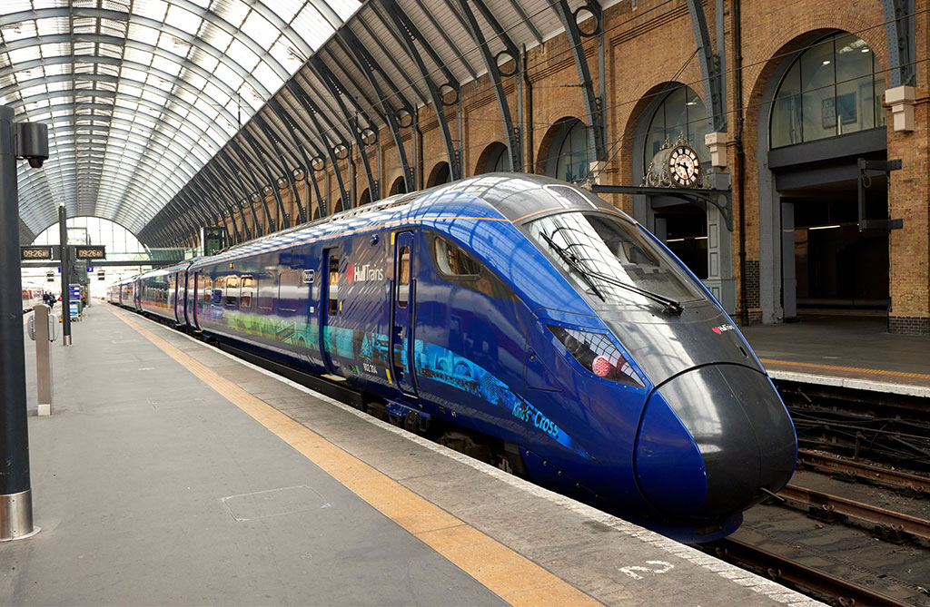An image of a blue train waiting at a platform at London King's Cross station