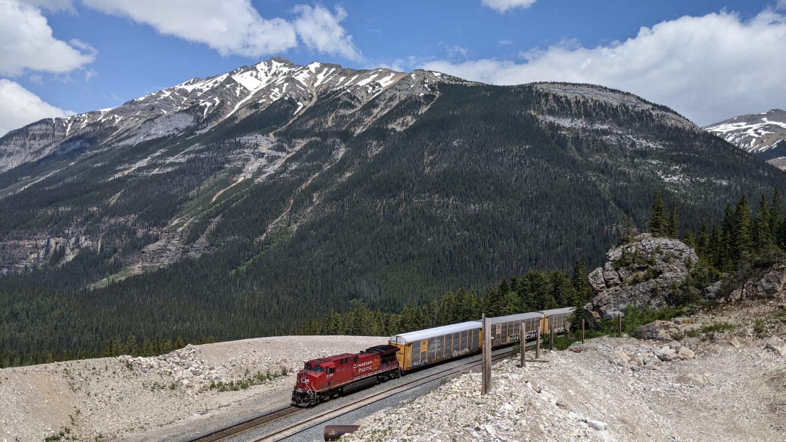 Freight train driving through the mountains