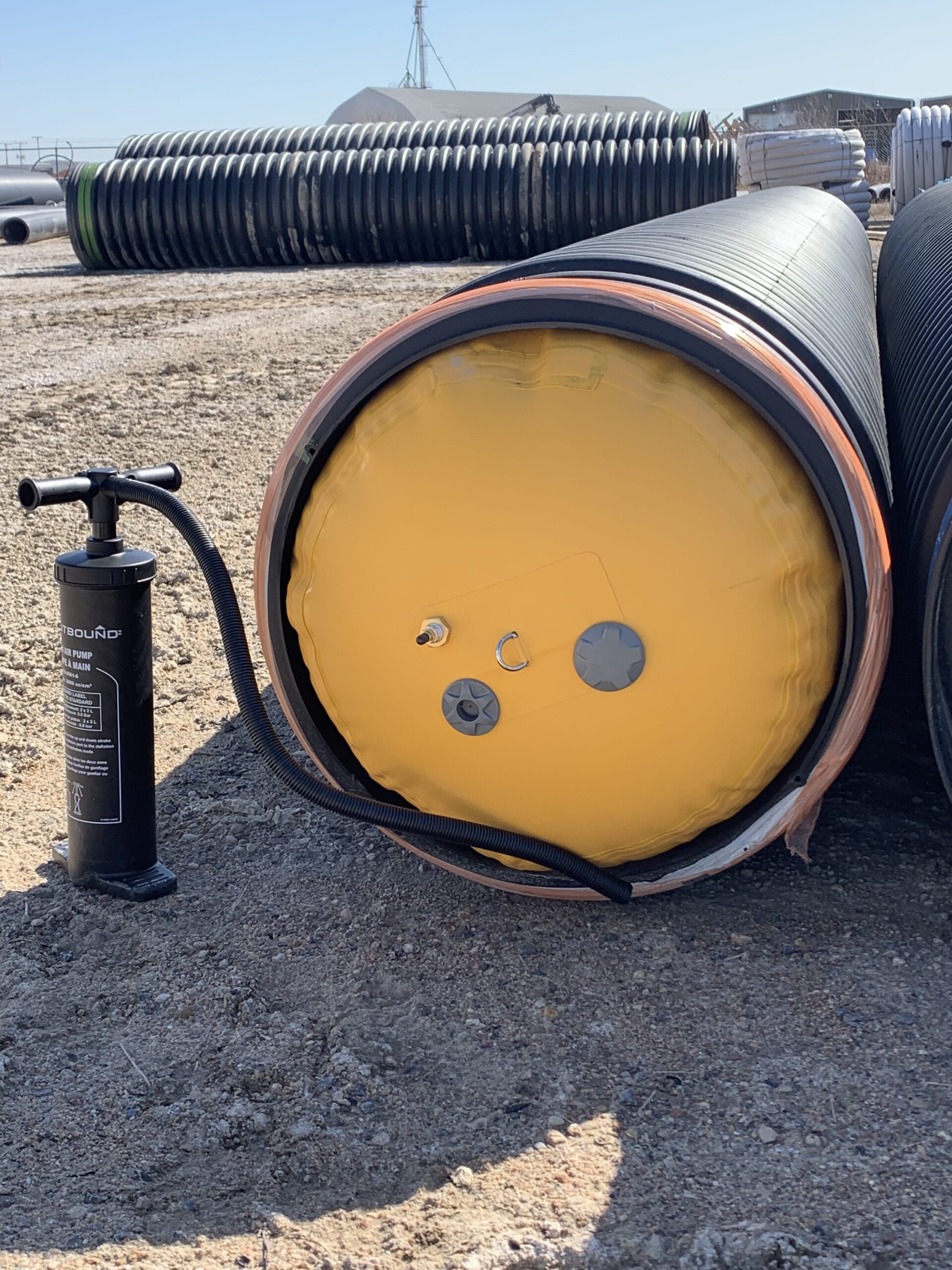 Yellow inflatable air bung inside a pipe