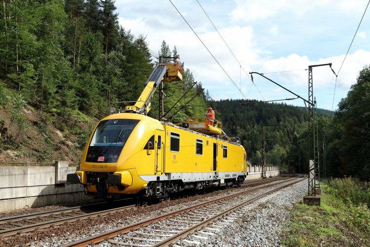 A yellow train on tracks