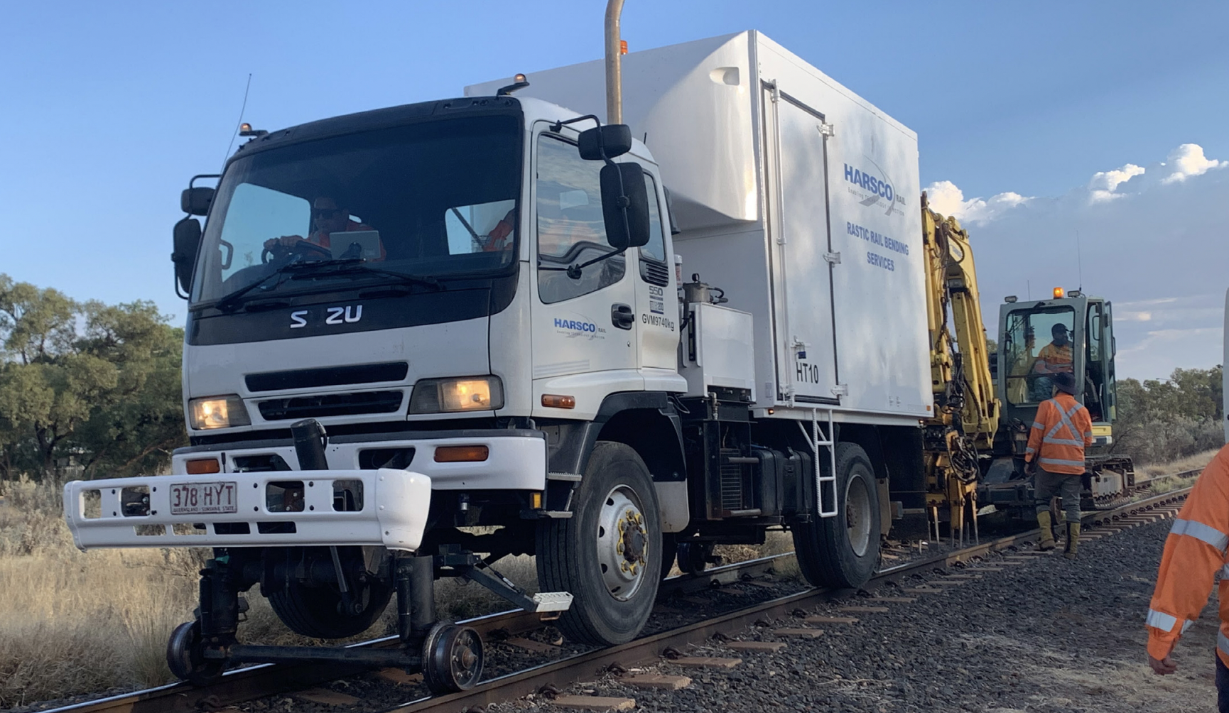 White truck stationary on a rail track