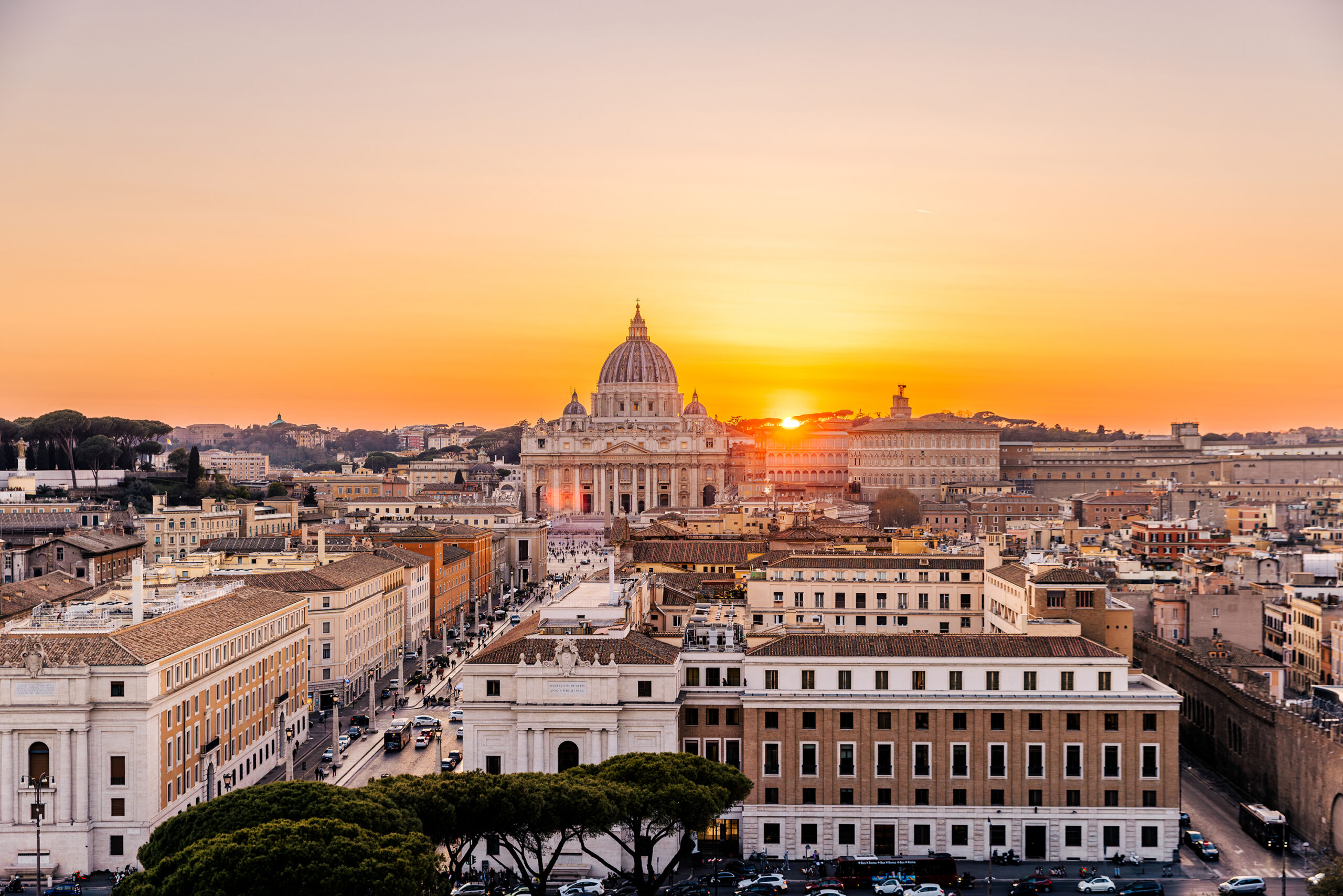 Aerial panoramic view of Rome skyline with St. Peter's Basilica at sunset, Italy