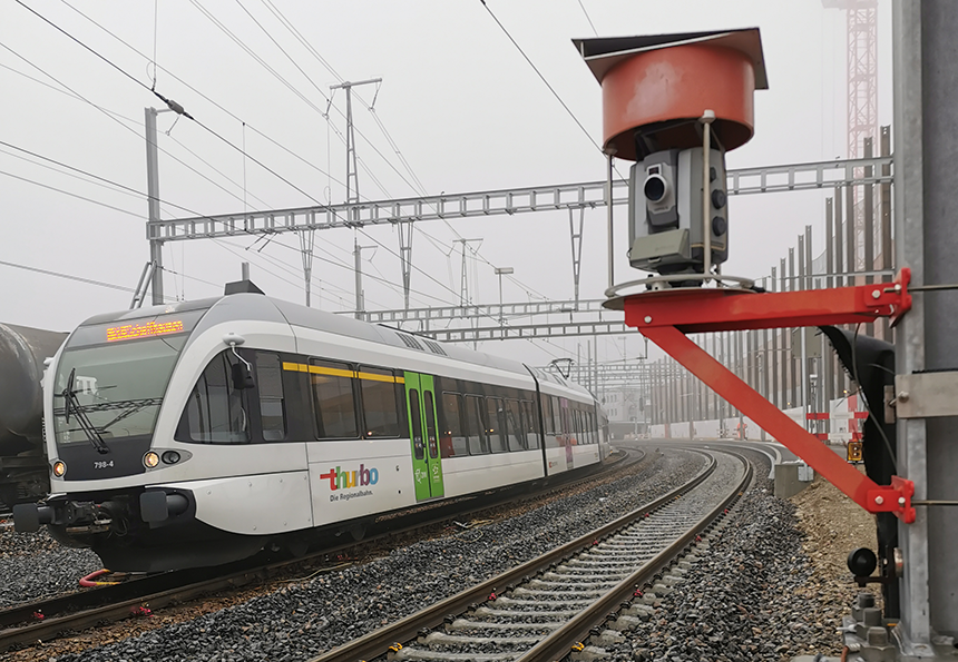 Trimble S7 total station with the construction site for the renovation of the railroad station in Wil (Canton of St. Gallen, Switzerland) in the background