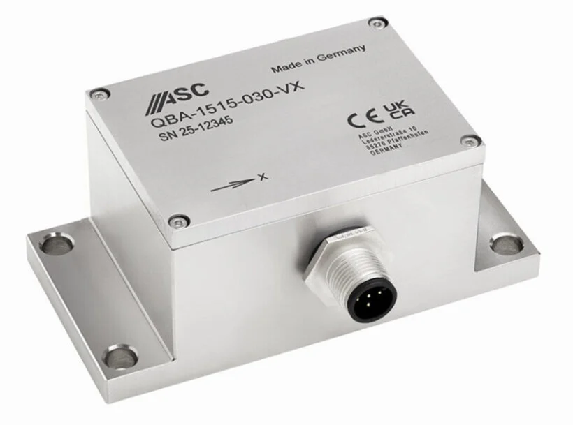 A metallic silver rectangular sensor, labeled "ASC QBA-1515-030-VX" and "Made in Germany," is positioned at an angle on a white background, featuring mounting flanges on its sides and a multi-pin connector.