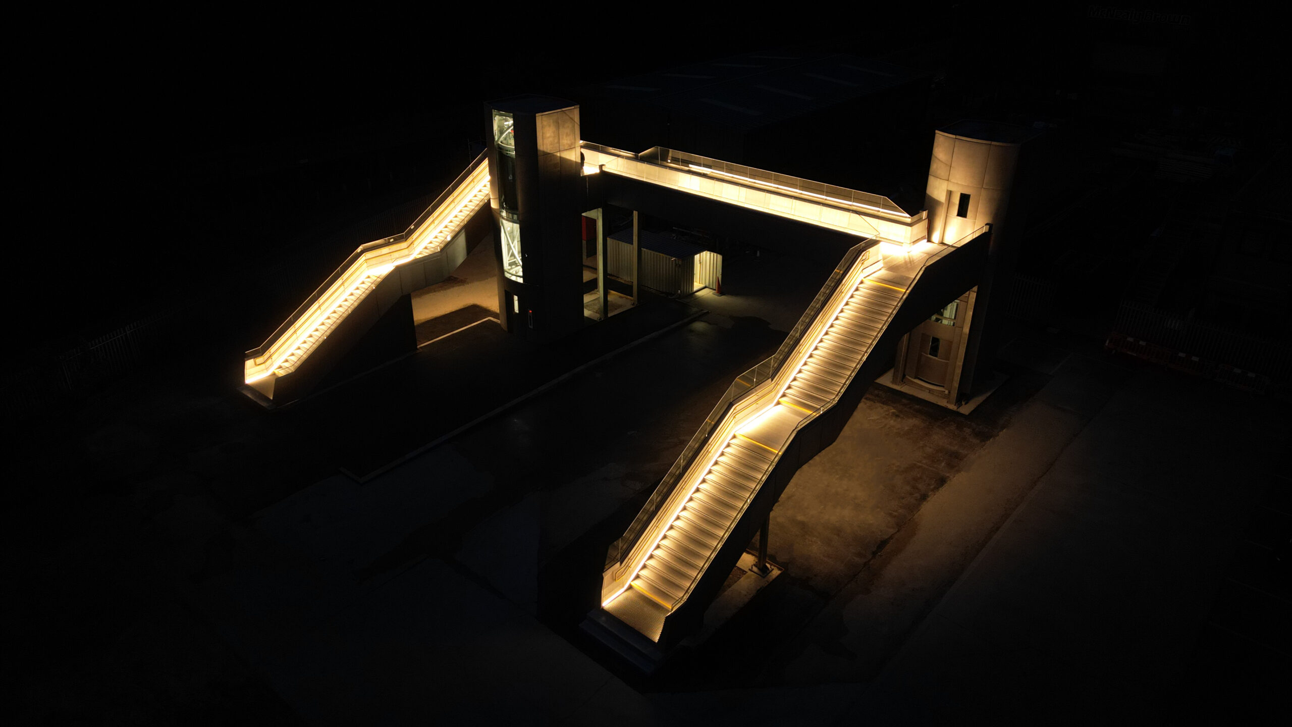 A footbridge at night