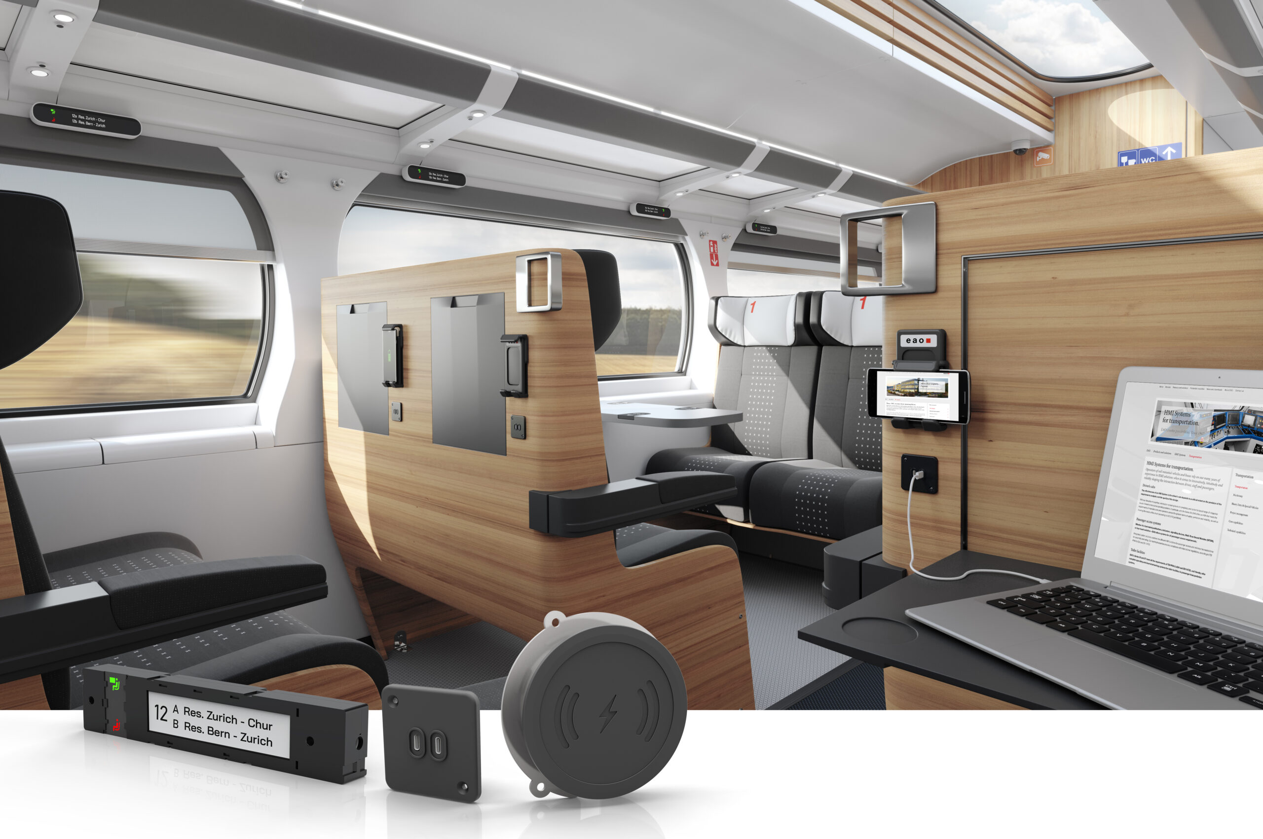 A modern train interior features comfortable seating, large windows, and integrated technology like screens, power outlets, and wireless charging.