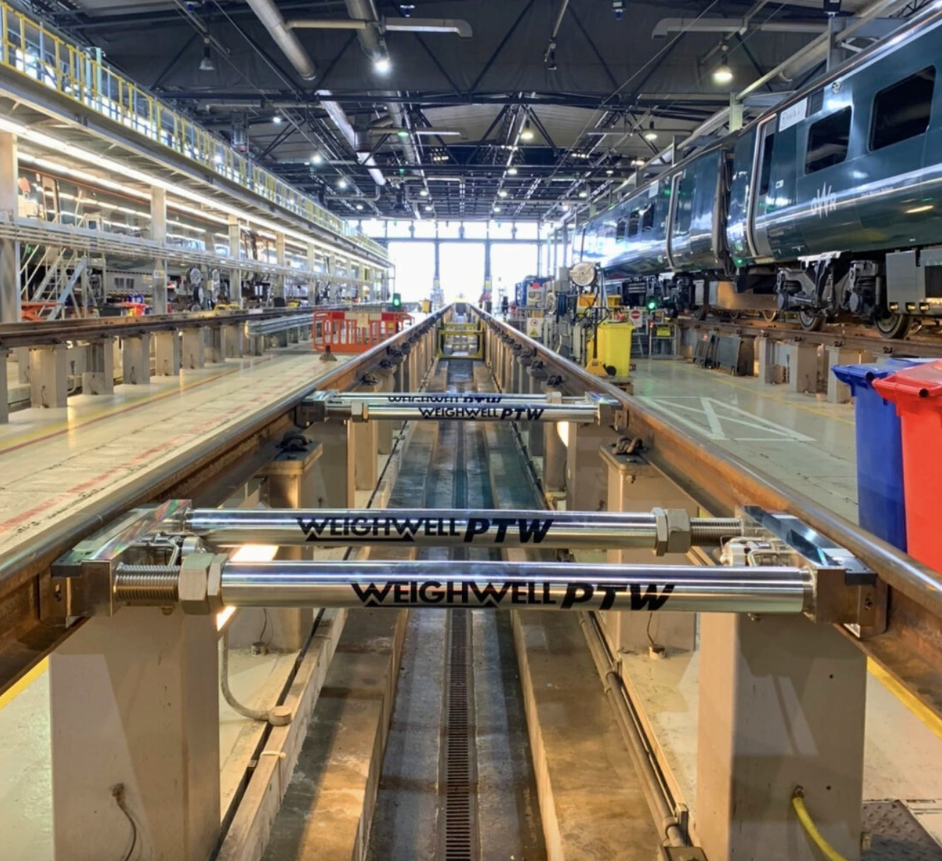Weighwell warehouse with train weighing devices in the foreground