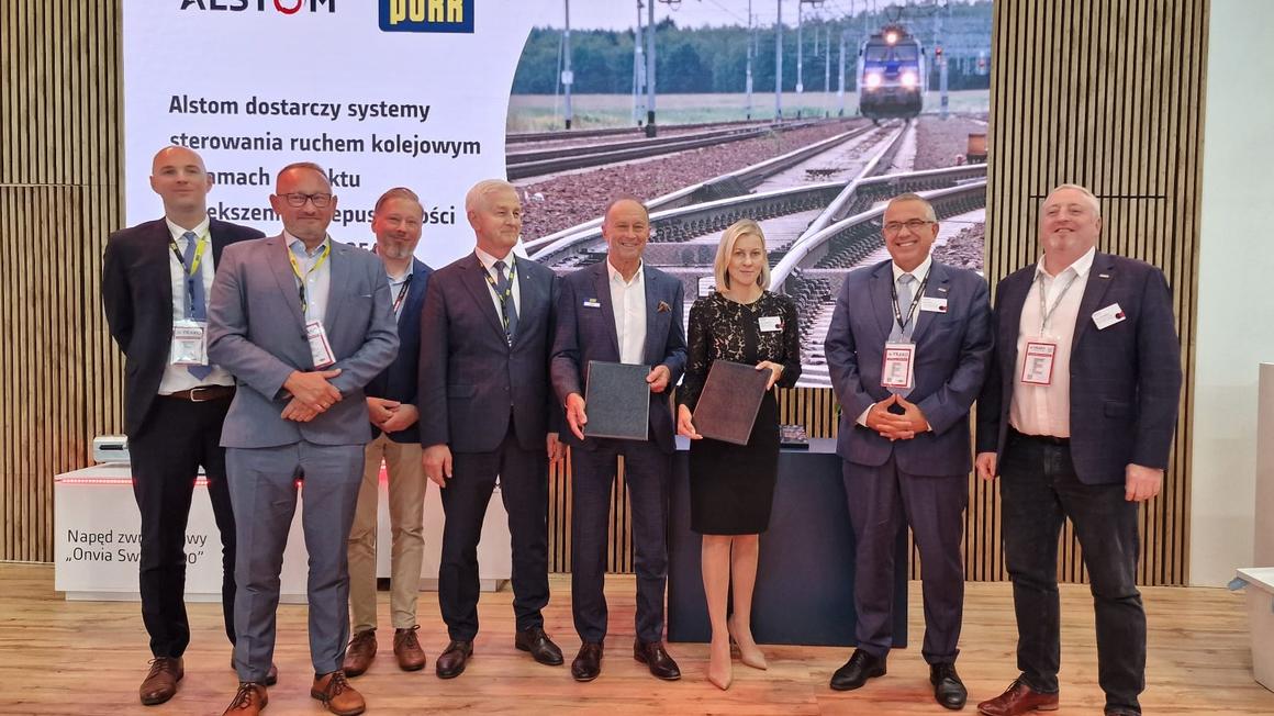 A group of people holding contracts