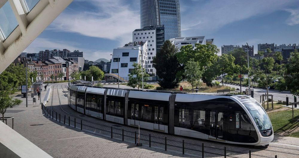 An Urbos tram travelling through a city