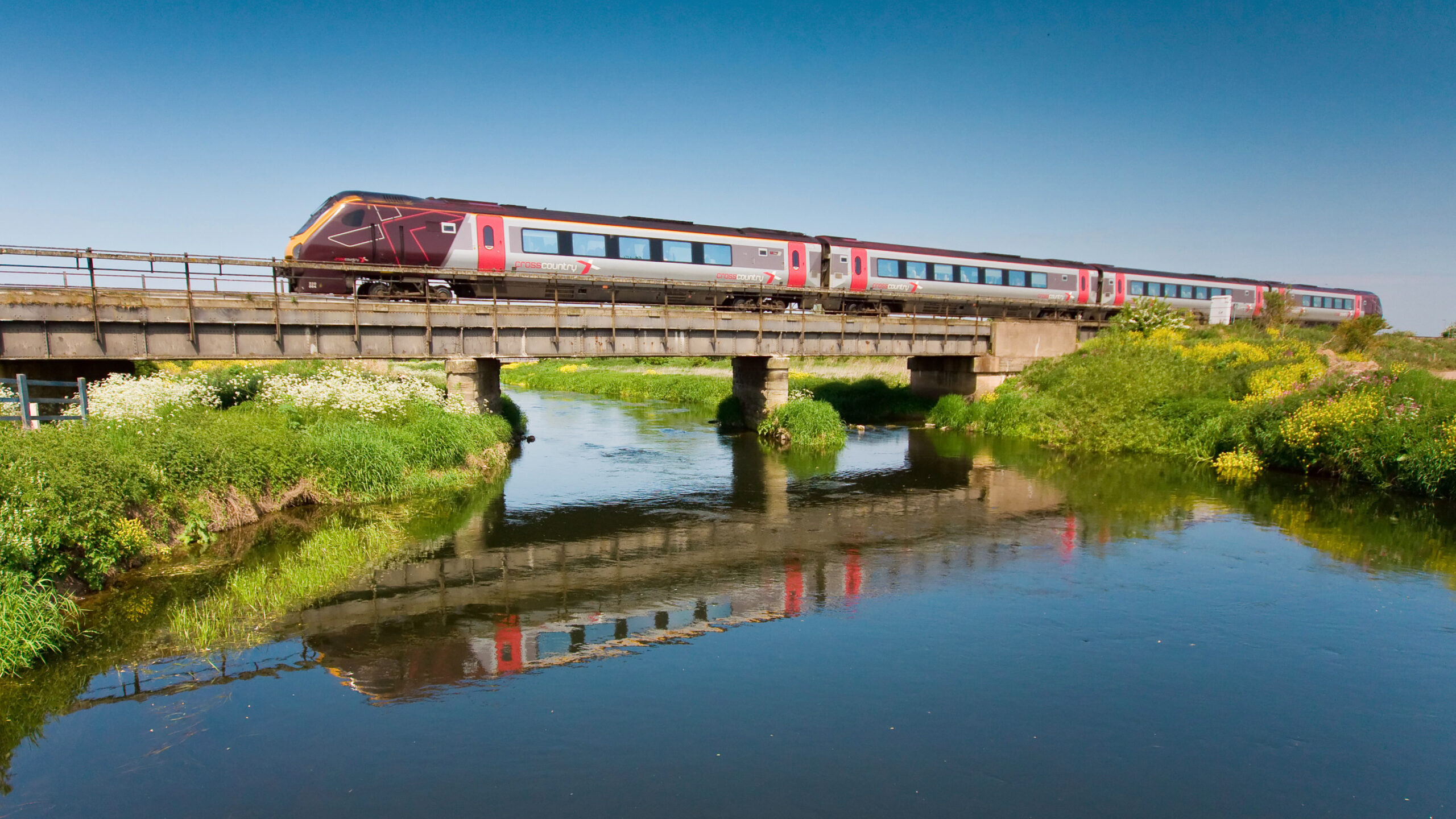 A CrossCountry Voyager train travelling over water