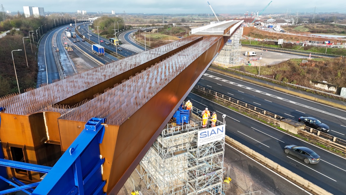 A viaduct being constructed over a motorway