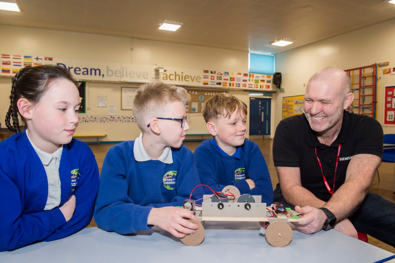 Schoolkids with a member of Siemens