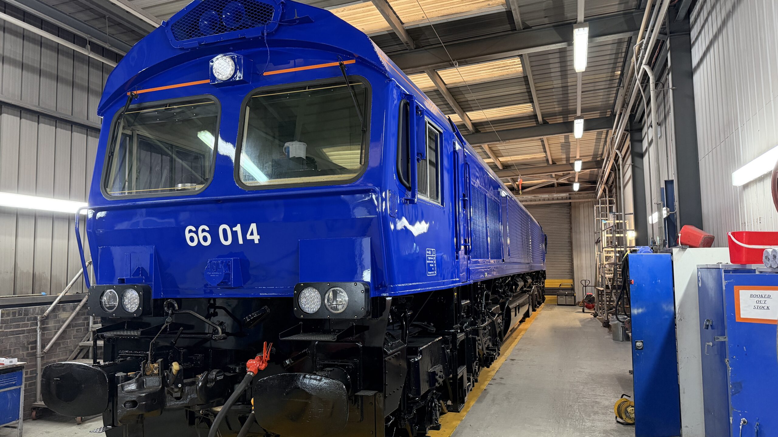 A blue Class 66 locomotive