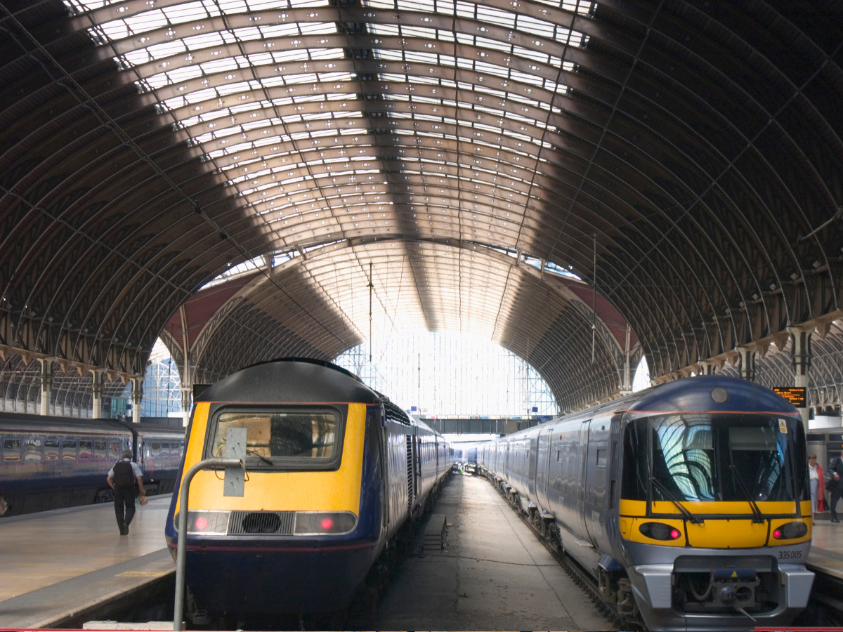 Two trains in a train station in the UK