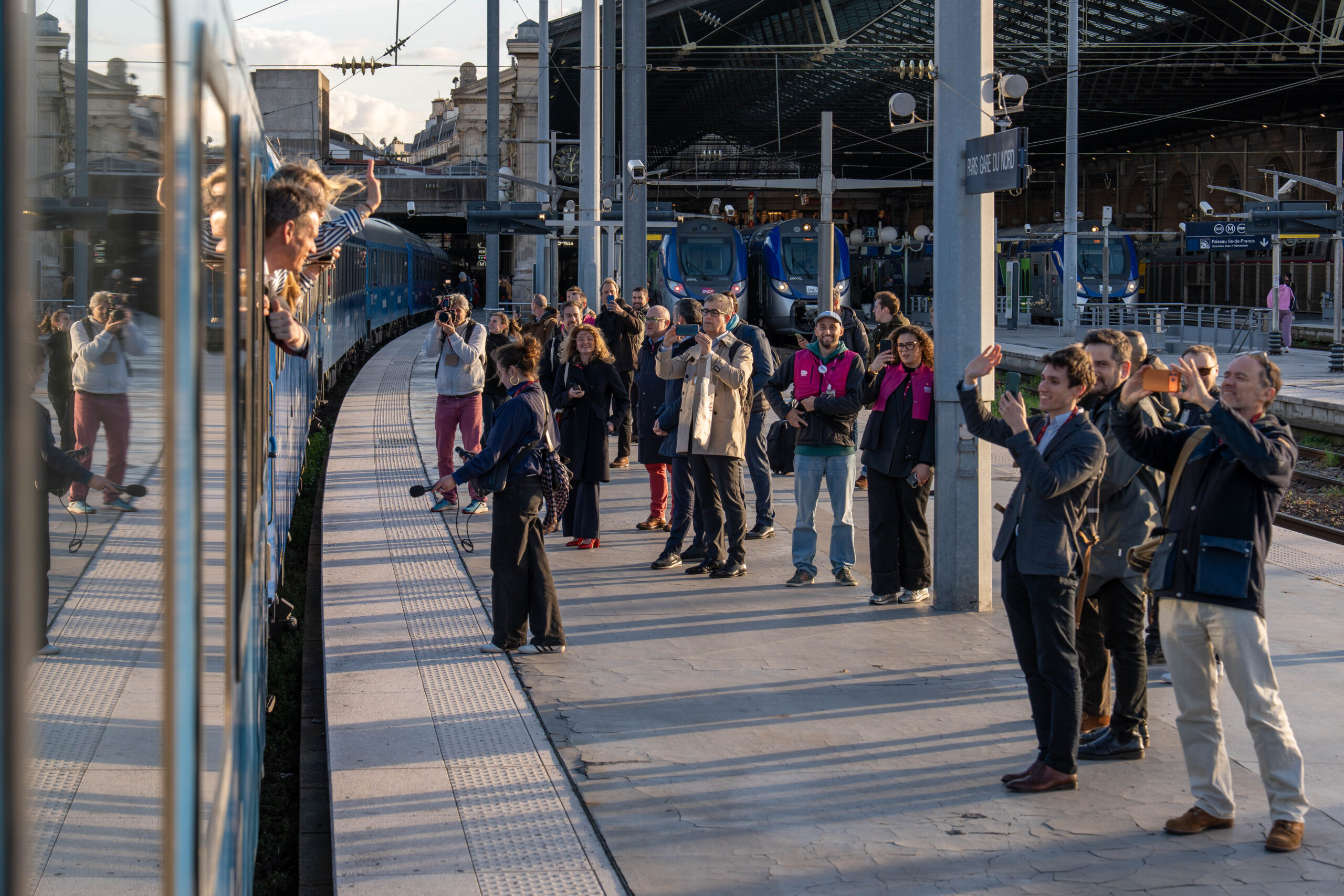 People waiting by a train