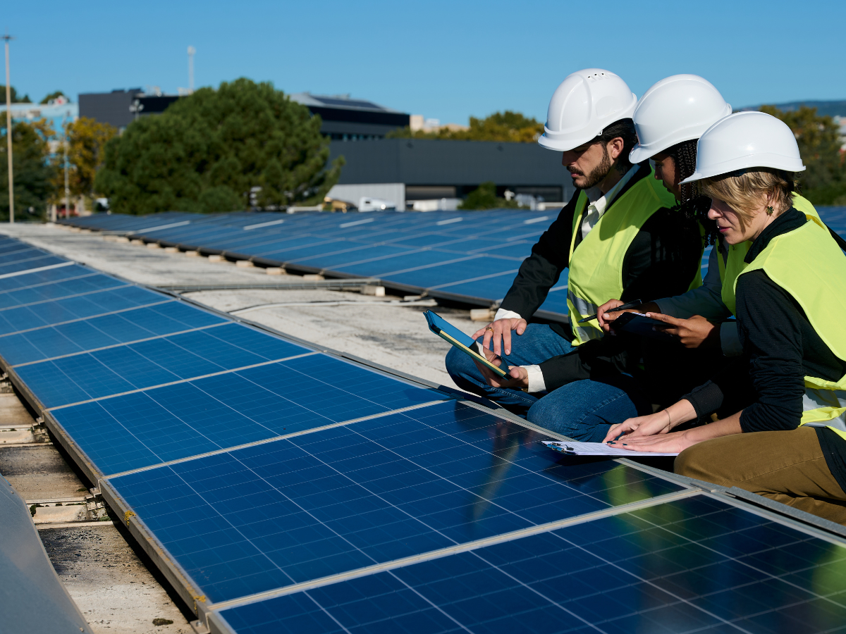 People working on solar panels