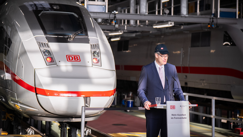 A man stood by a train