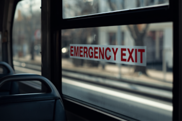Emergency exit on a vehicle window