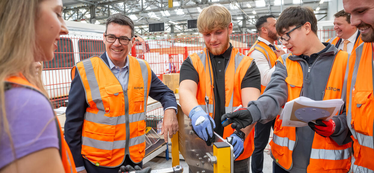UK Prime Minister Andy Burnham learns torque tightening skills with Alstom apprentices