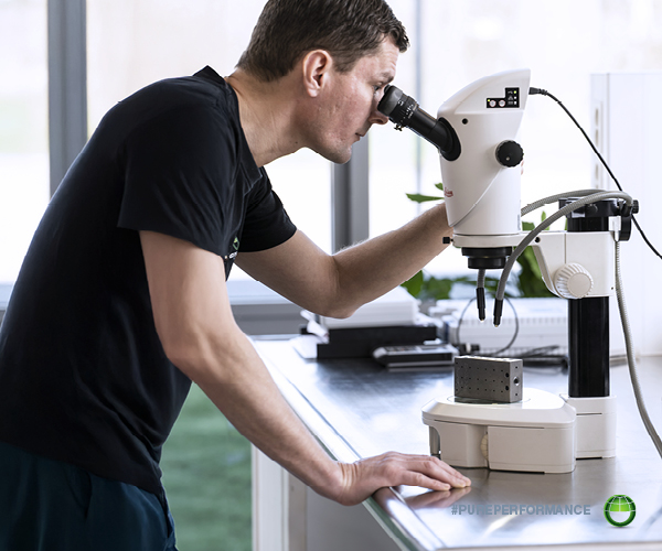 Microscopic inspection of a cleaned metal component. Surface cleanliness analysis ensures the chemistry is delivering the required result before full implementation.