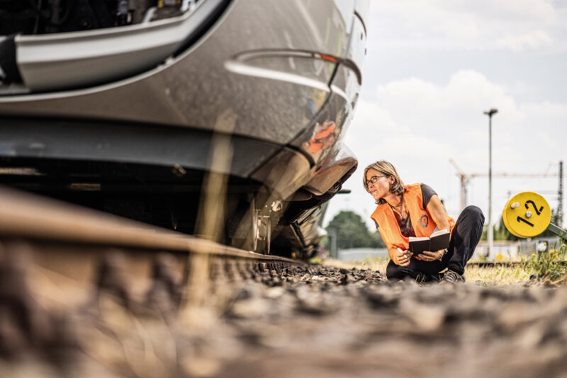 Jennifer Paulin looking under a train