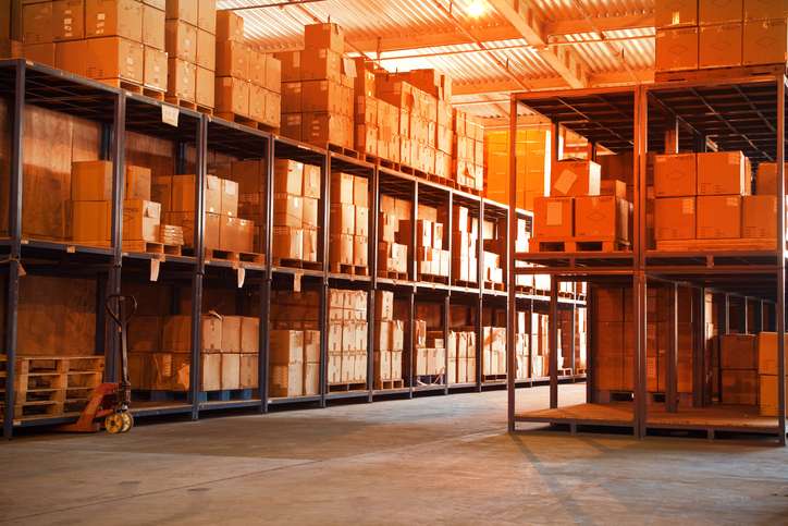 Shelves full of boxes at a stocked warehouse