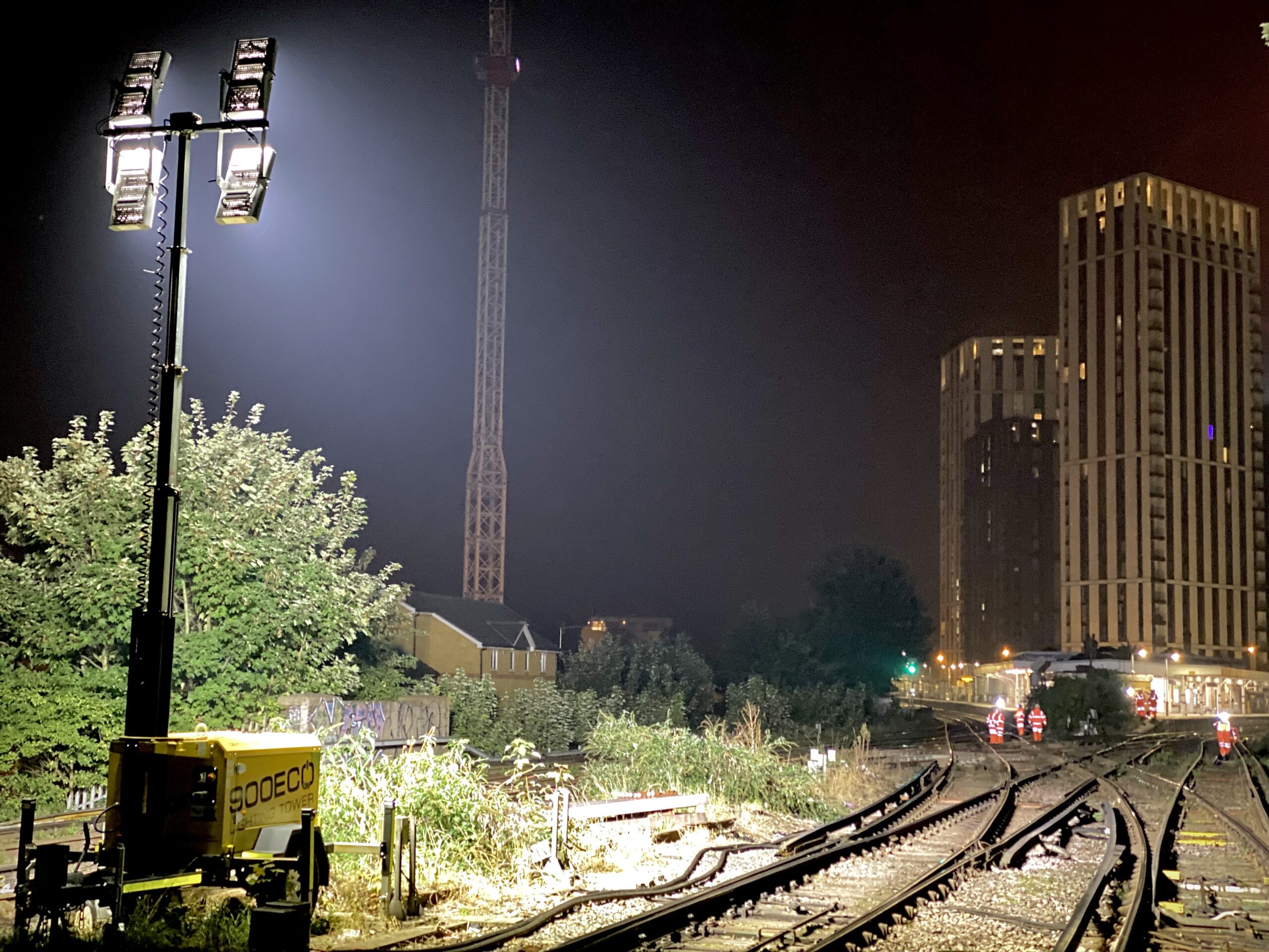 900ECO mobile lighting tower illuminating a rail junction at Lewisham, London, at night