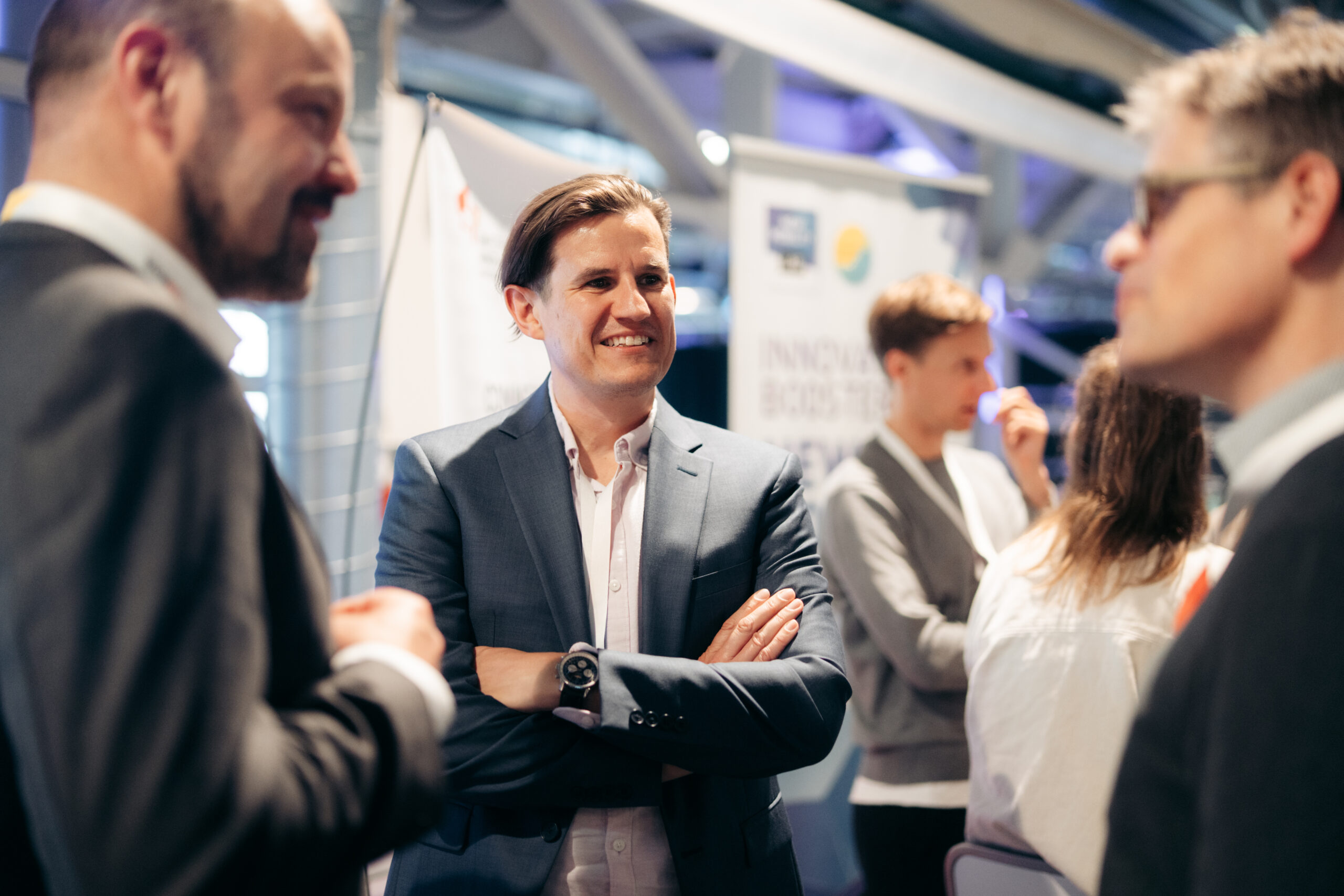 Delegates talking at an industry conference