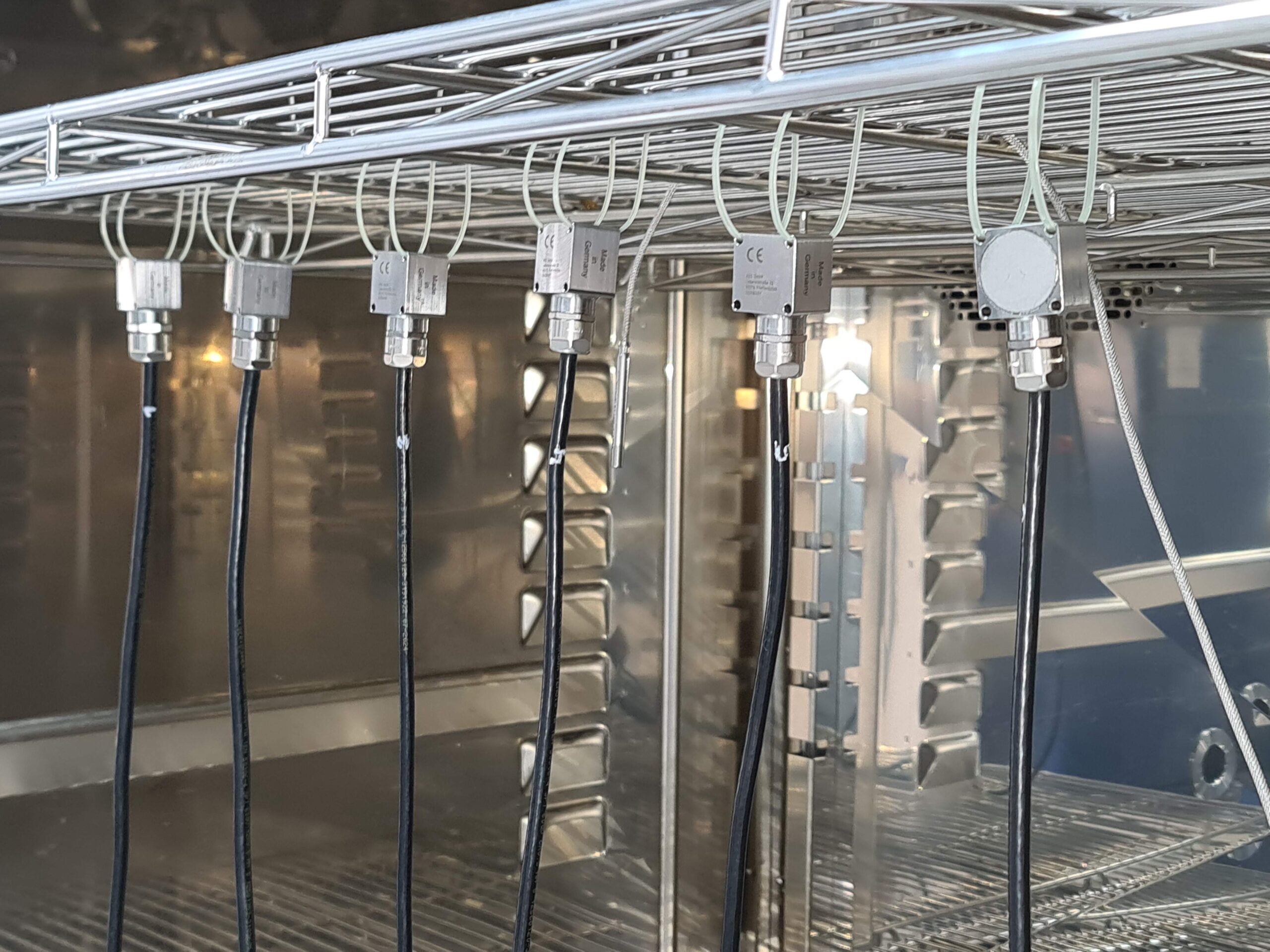 Row of ASC RAIL sensors installed inside a climatic test chamber for environmental robustness testing