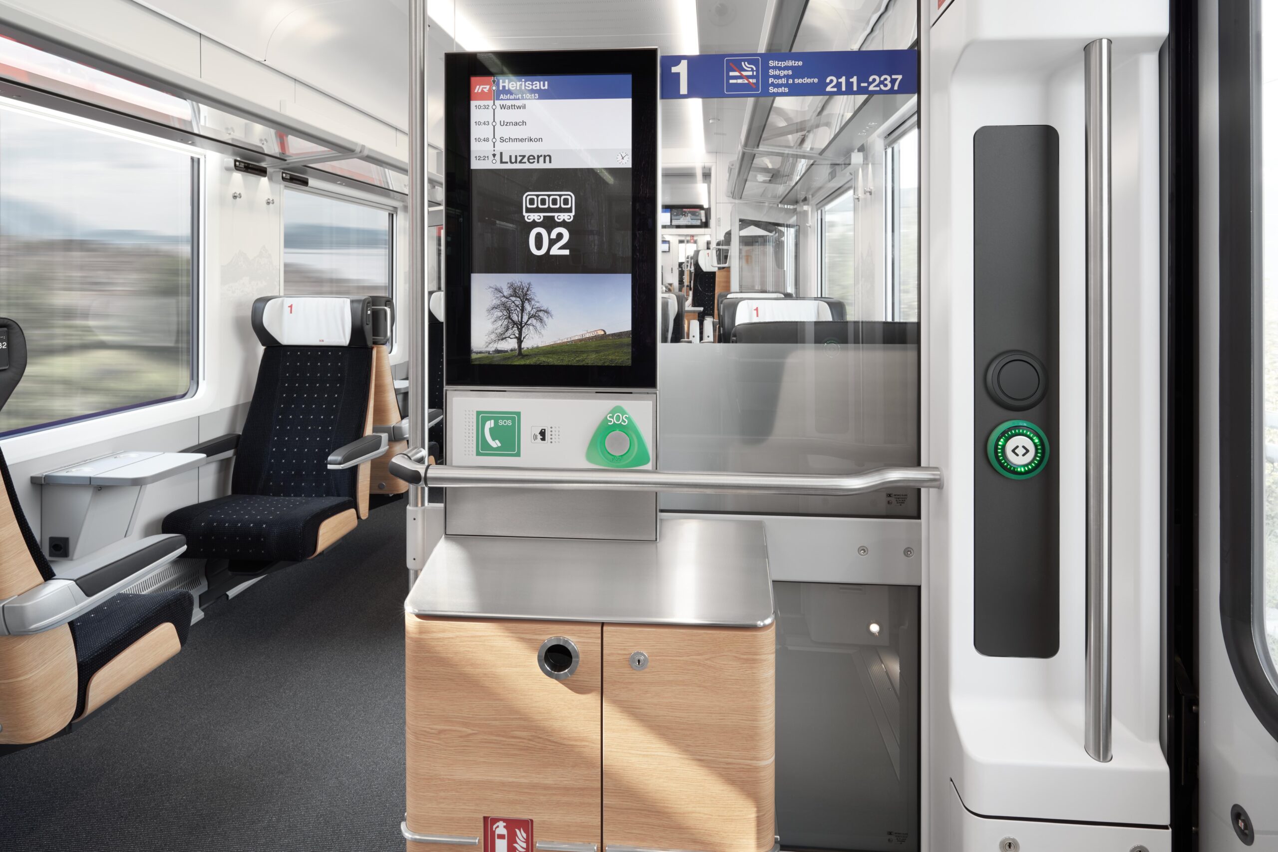Train interior showing EAO HMI products including an SOS emergency call panel and illuminated door open/close button