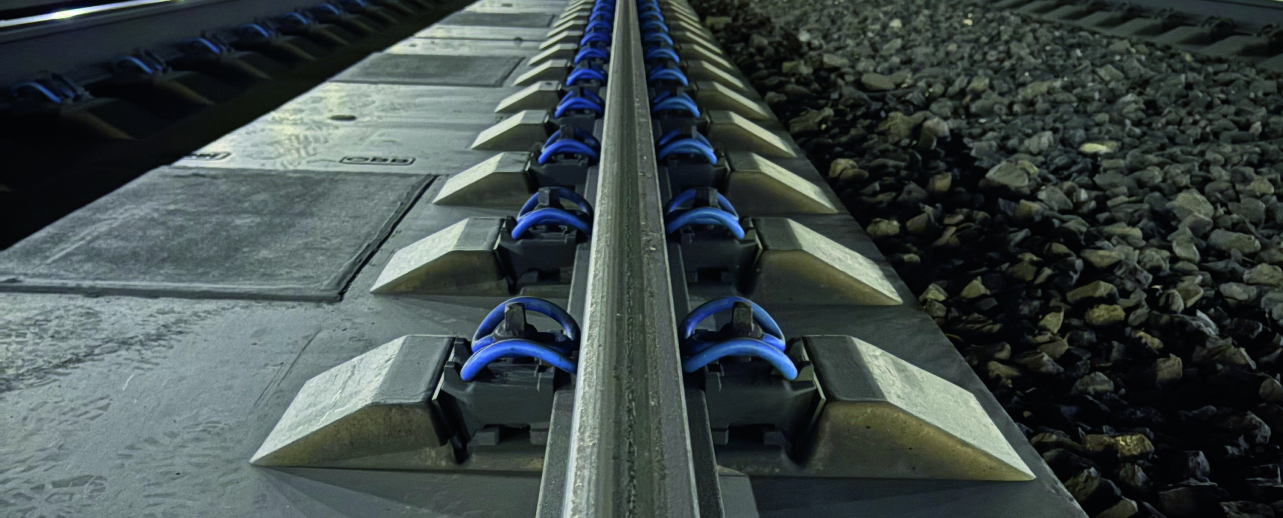 Fastening System 300 tension clamps securing rail to slab track